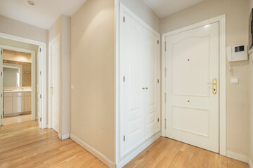 Home entrance and corridor with white and oak carpentry in vacation rental apartment
