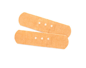 Sticking plasters isolated on white, top view. First aid item