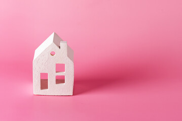 Miniature white toy house on pink pastel background Trendy Background Property Insurance dream home concept copy space