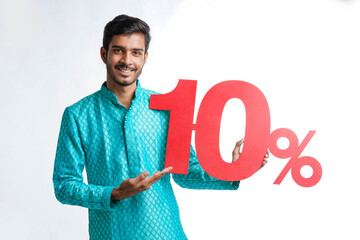 Indian man holding ten percent sign board promoting offers on festival season while wearing...