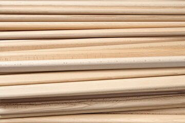 Huge pile of wooden bars made of solid beechwood material lies in contemporary carpentry workshop as backgroung closeup upper view