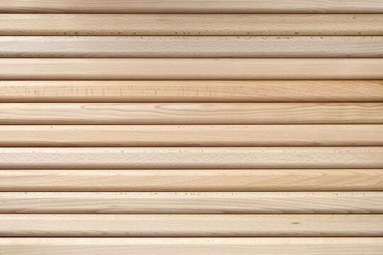 Wooden bars made of solid beechwood material lies in contemporary carpentry workshop as backgroung closeup upper view