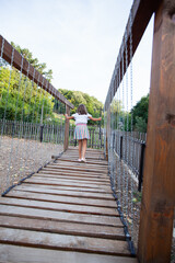Fototapeta premium Little girl fun at playground on summer day.