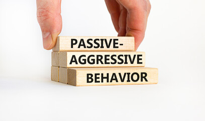 Passive-aggressive behavior symbol. Concept words Passive-aggressive behavior on wooden blocks....