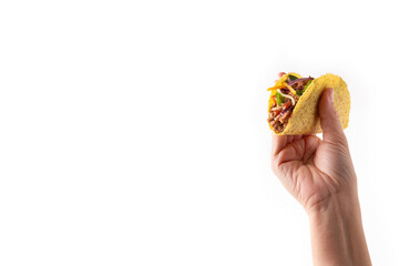 Hand holding traditional Mexican tacos with meat and vegetables isolated on white background