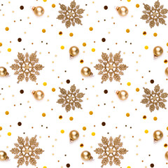 Seamless white New Year's Eve background with gold snowflakes, decorative balls, shining stars and shiny confetti