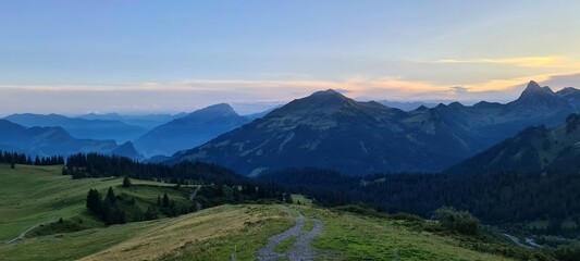 Fototapeta premium Mountain panorama of the Ratikon Alps in the evening during a hike across Austria and Switzerland.