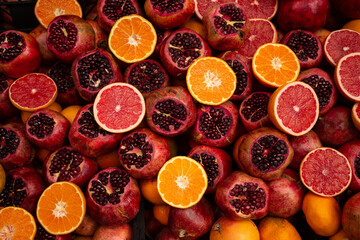 pomegranates oranges and grapefruits background