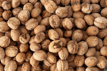 Top view photo of dried shelled walnuts as a background.