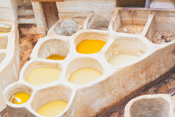 Old tanks of the Fez's tanneries with color paint for leather, Morocco, Africa