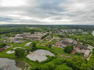 Fototapeta na wymiar Aerial view of the village in summer in cloudy weather (Murygino, Kirov region, Russia)