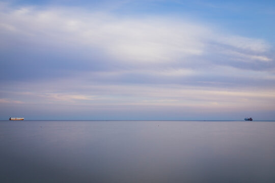 View of two cargo ship in the Mediterranean Sea off Salerno coastline, Campania, Italy.