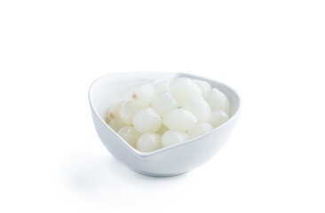 Fototapeta na wymiar Pickled mini baby onions in white saucer isolated on white