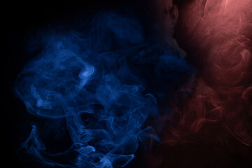 Obraz premium Blue and pink steam on a black background.