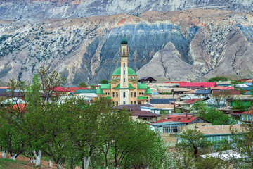 Mosque in spring in an authentic mountain village. Mosque in the center of a mountain village. Landscape and countryside of cityscape in Salta. Dagestan.