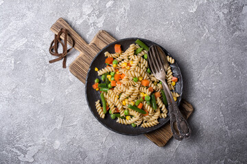 Plate of Italian rotini pasta with vegetables