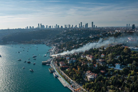 Aerial view of a sailing boat on fire at the dock along the Marmara sea in Istanbul, Turkey.