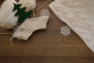 White yarn, knitting threads. Handicraft, hat and scarf