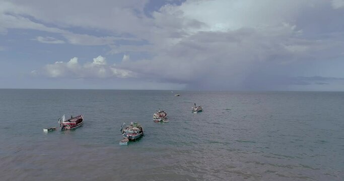 Wooden fishing boats anchored on the Bagamoyo beach