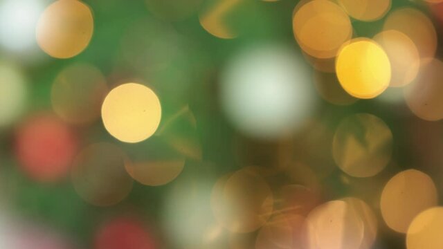 blurred defocused yellow, pink, white, red, green, golden blinking circles round bokeh background. abstract festive celebration mood. party, anniversary, holidays concept copy space 