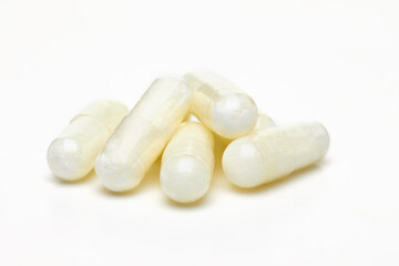 Fototapeta na wymiar Herb capsule, Nutritional Supplement, Vitamin Pill, Herbal Medicine on white background