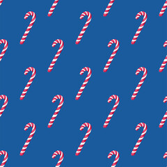 Candy cane on blue background. Seamless pattern.Texture for fabric, wrapping, wallpaper