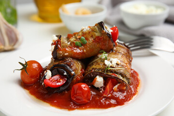 Tasty eggplant rolls served on table, closeup