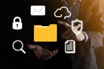 Document Management System DMS .Businessman hold folder and document icon.Software for archiving, searching and managing corporate files and information.Internet Technology Concept.Digital security