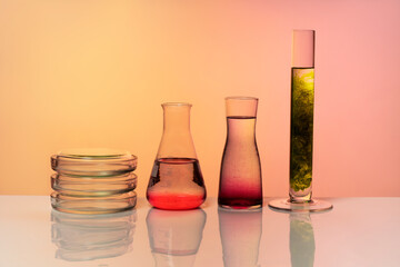 Medical or chemical background with laboratory equipment and liquids.