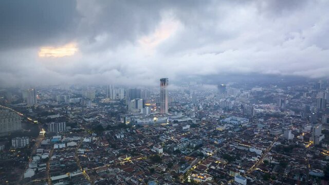 Time lapse of rolling clouds over city of Penang (Pulau Pinang) Malaysia during sunset dusk. 