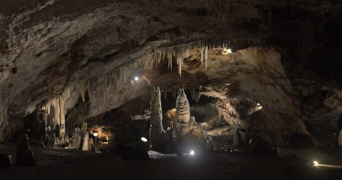 Beautiful shots of karst cave, Lipa Cave situated Serbia, East Europe. Illuminated dark cave with stalactites and stalagmites. Unique nature landscape. High quality 4k footage