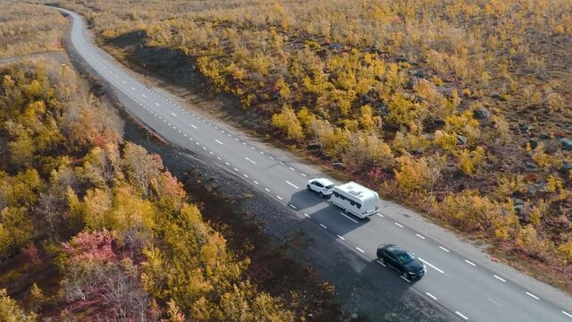 50fps drone footgage Car Camping Caravan driving road lake Swedish Lapland Sunny fall colors Abisko National Park Sweden