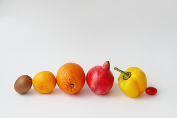 Juicy fruits and vegetables on a white background