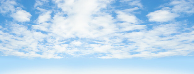 Blue sky with puffy clouds