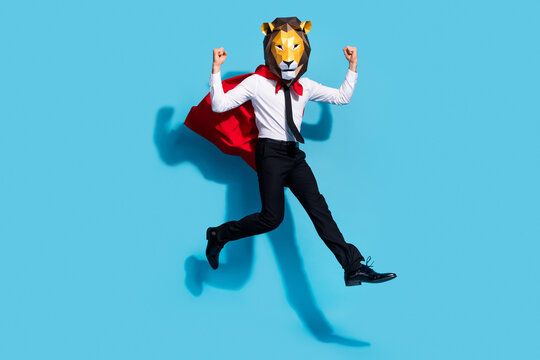 Full size photo of weird authentic anonym guy in lion mask jump feel strength safe planet isolated over blue color background