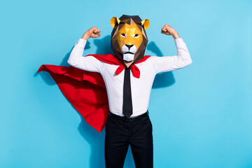 Photo of strong courage guy lion mask save planet world show muscles isolated over blue color...