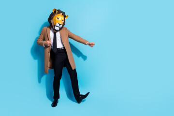 Full length photo of excited lion character guy dance theme festive event empty space isolated over blue color background