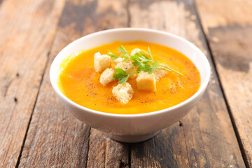 bowl of pumpkin soup and crouton