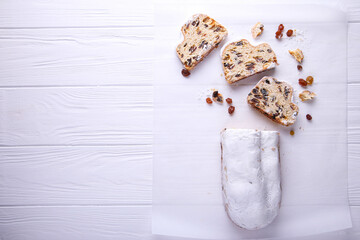 Dresdner Stollen is a Traditional German Cake with raisins on white background with place for text. Fruit cake for the Holiday.