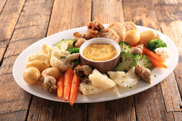 platter of aioli, fish and vegetables