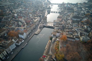 Fototapeta premium Aerial view of City of Zürich with river Limmat and medieval old town on a cloudy autumn day. Photo taken November 18th, 2021, Zurich, Switzerland.