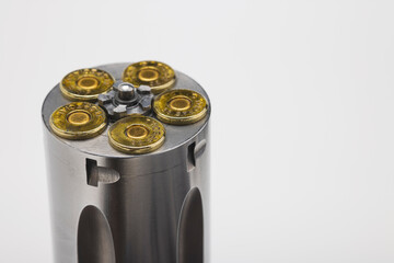 .38 special gun bullets with stainless revolver cylinder on white background