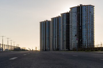 Photo of high multistorey buildings in the evening in the city. Urban concept