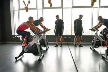 Aged couple of sports people while endurance training