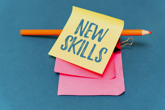 Text sign showing New Skills. Business overview Recently Acquired Learned Abilities Knowledge Competences Multiple Assorted Collection Office Stationery Photo Placed Over Table