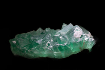 isolated green fluorite crystal mineral in black background