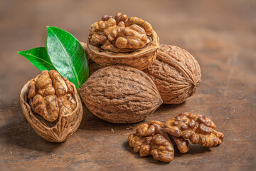 Walnuts on dark rustic background. Walnuts kernels with  Copyspace.  Nut healthy food concept. Closeup.