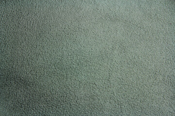 Green terry fabric texture. Green background 