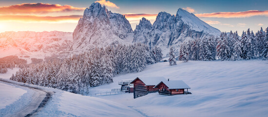 Christmas poster. Panoramic winter view of Alpe di Siusi village with Plattkofel peak on background. Amazing morning scene of Dolomite Alps. Stunning winter landscape of Ityaly, Europe.