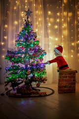 Baby santa and christmas tree